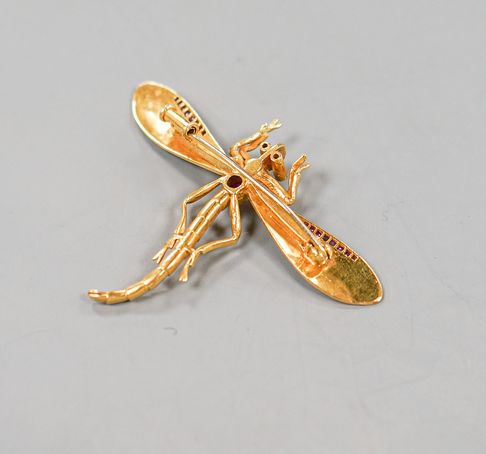 A yellow metal, ruby diamond and cultured pearl set dragonfly brooch, diameter 52mm, gross weight 8 grams.